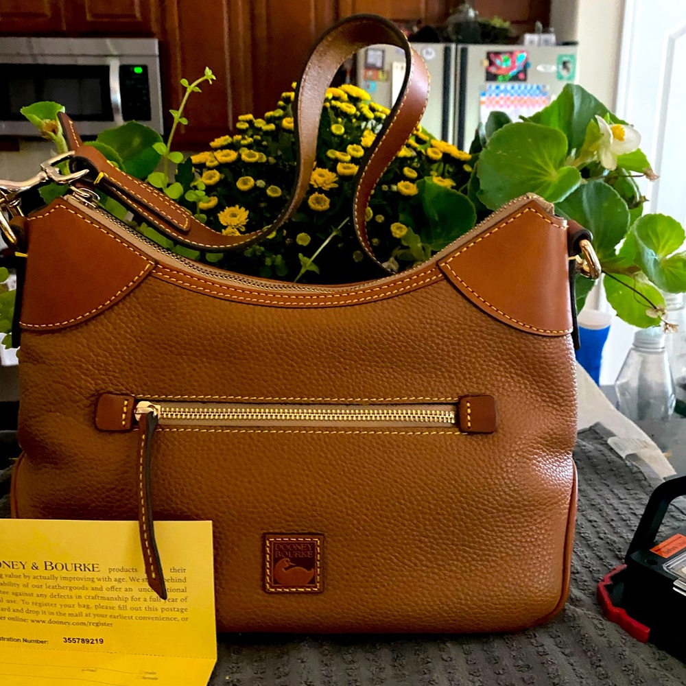 Dooney satchel like new dust bag included natural color